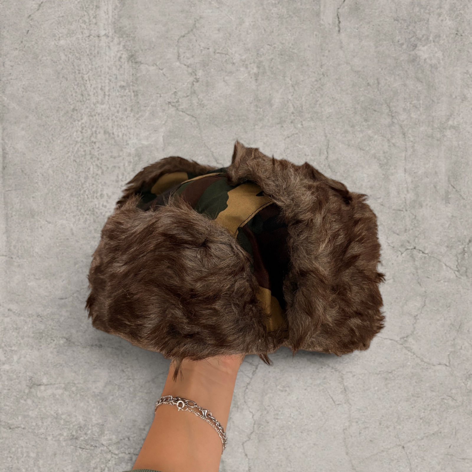 Russian ushanka hat in khaki camo print with faux fur.