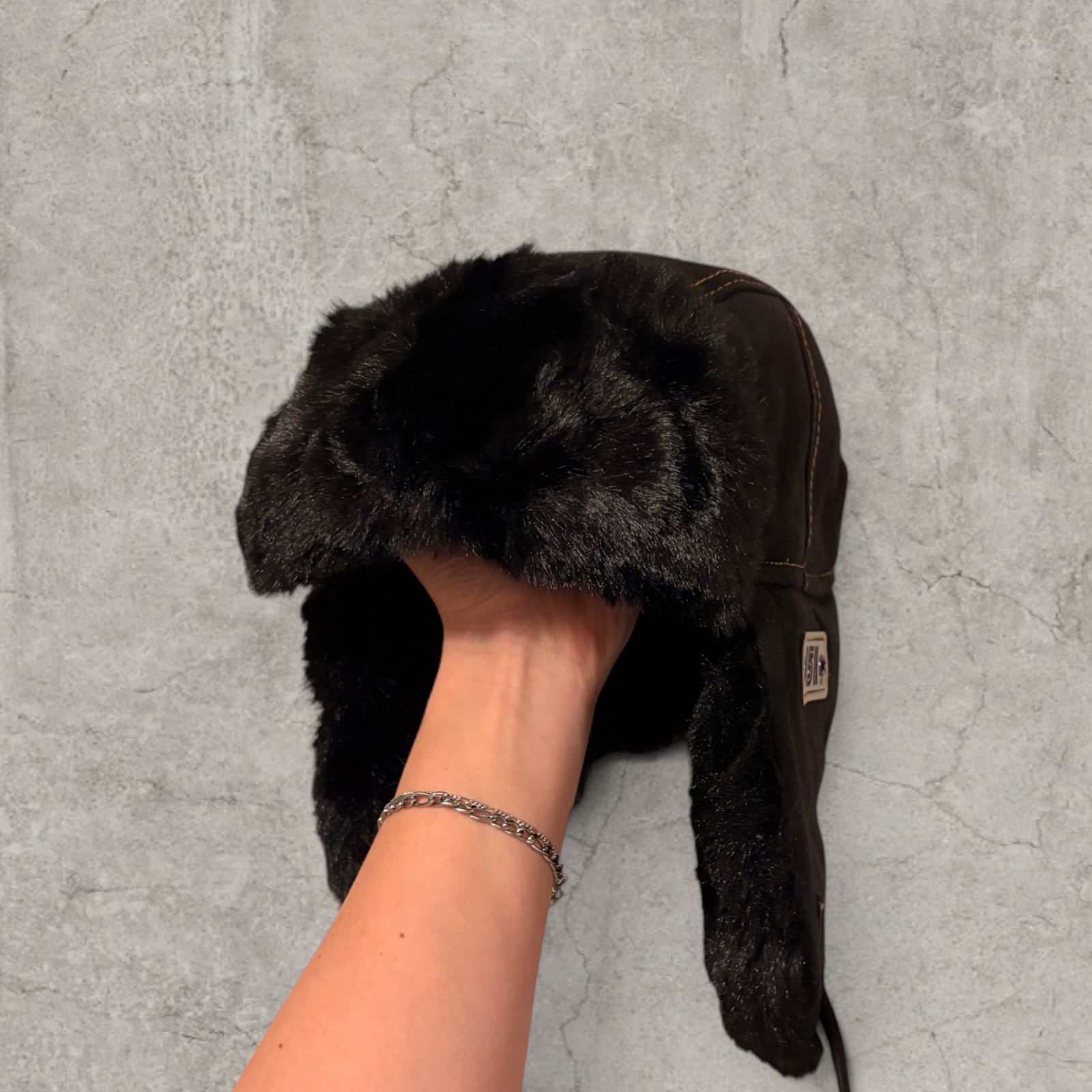 Russian ushanka hat in black with black faux fur.