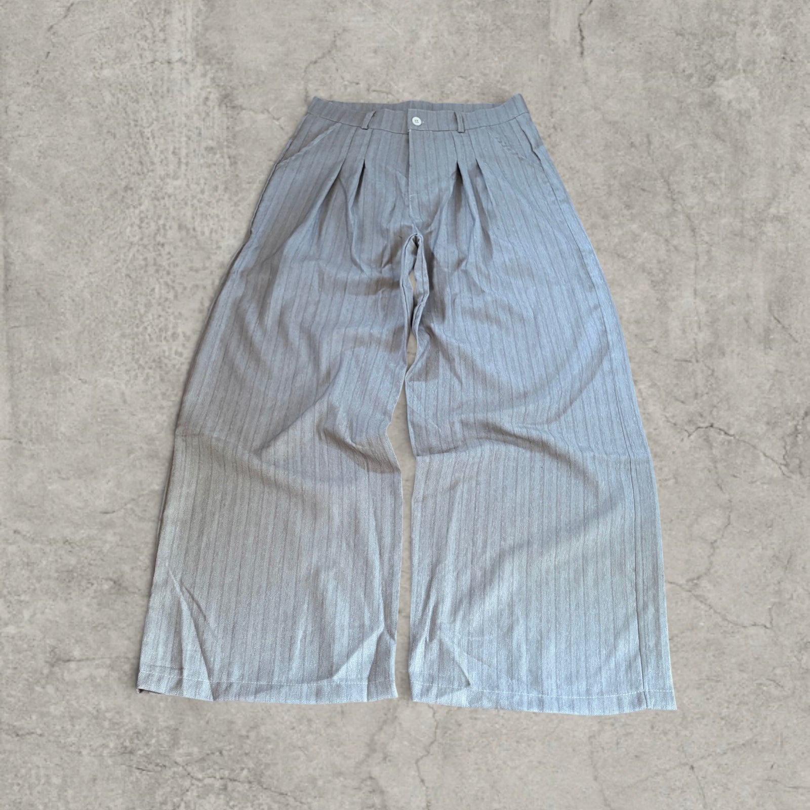 Wide-leg pinstriped trousers in beige cream