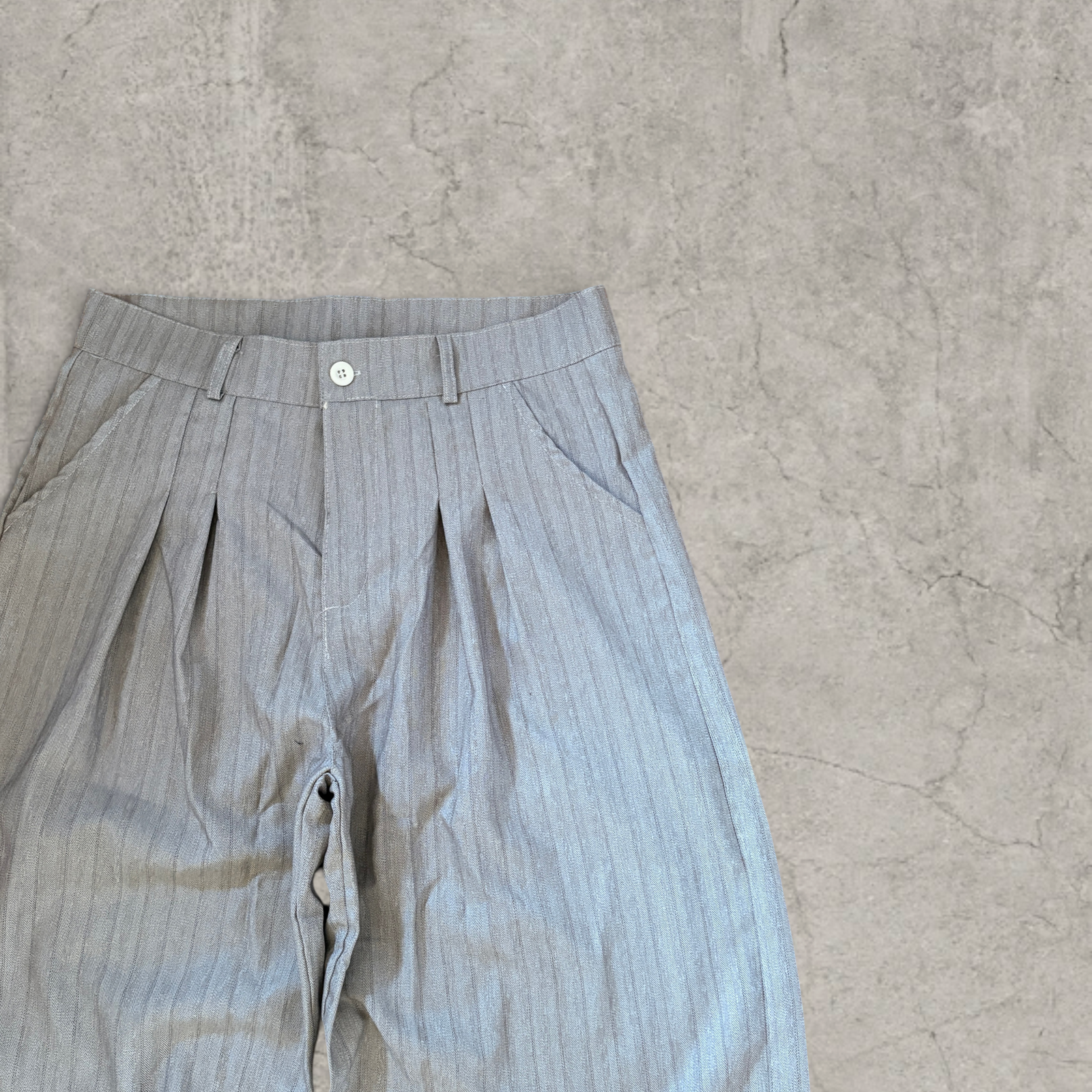 Wide-leg pinstriped trousers in beige cream