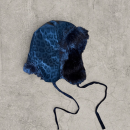 Russian trapper bonnet hat in black animal leopard print with black fur.