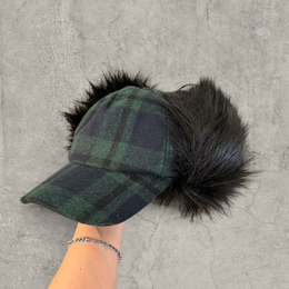 Russian ushanka trapper hat in dark green plaid with black faux fur.