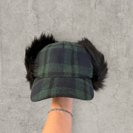 Russian ushanka trapper hat in dark green plaid with black faux fur.