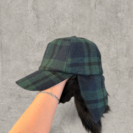 Russian ushanka trapper hat in dark green plaid with black faux fur.