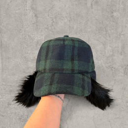 Russian ushanka trapper hat in dark green plaid with black faux fur.