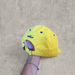 Vintage style baseball cap in yellow with navy blue Scandinavian logo.