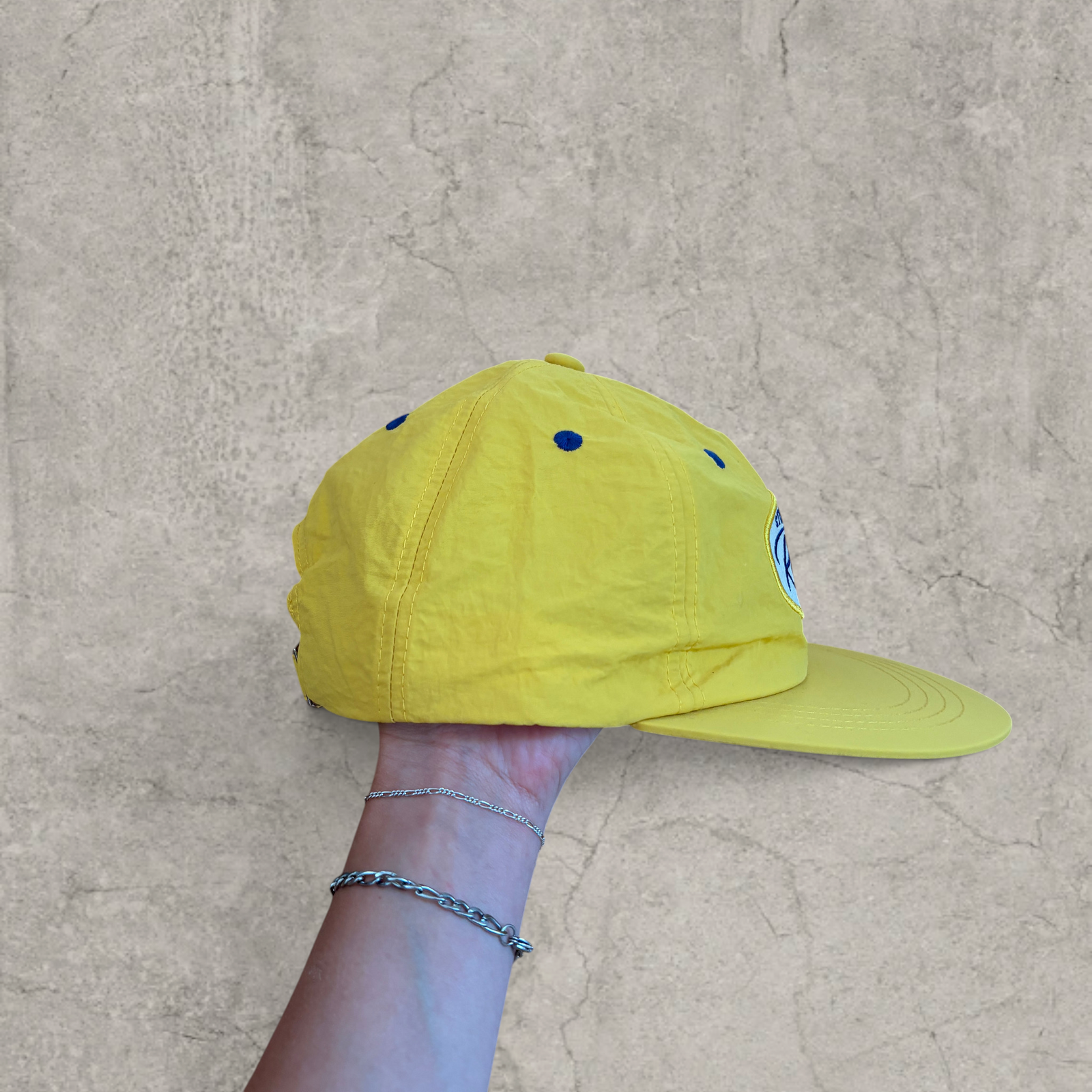 Vintage style baseball cap in yellow with navy blue Scandinavian logo.
