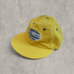 Vintage style baseball cap in yellow with navy blue Scandinavian logo.