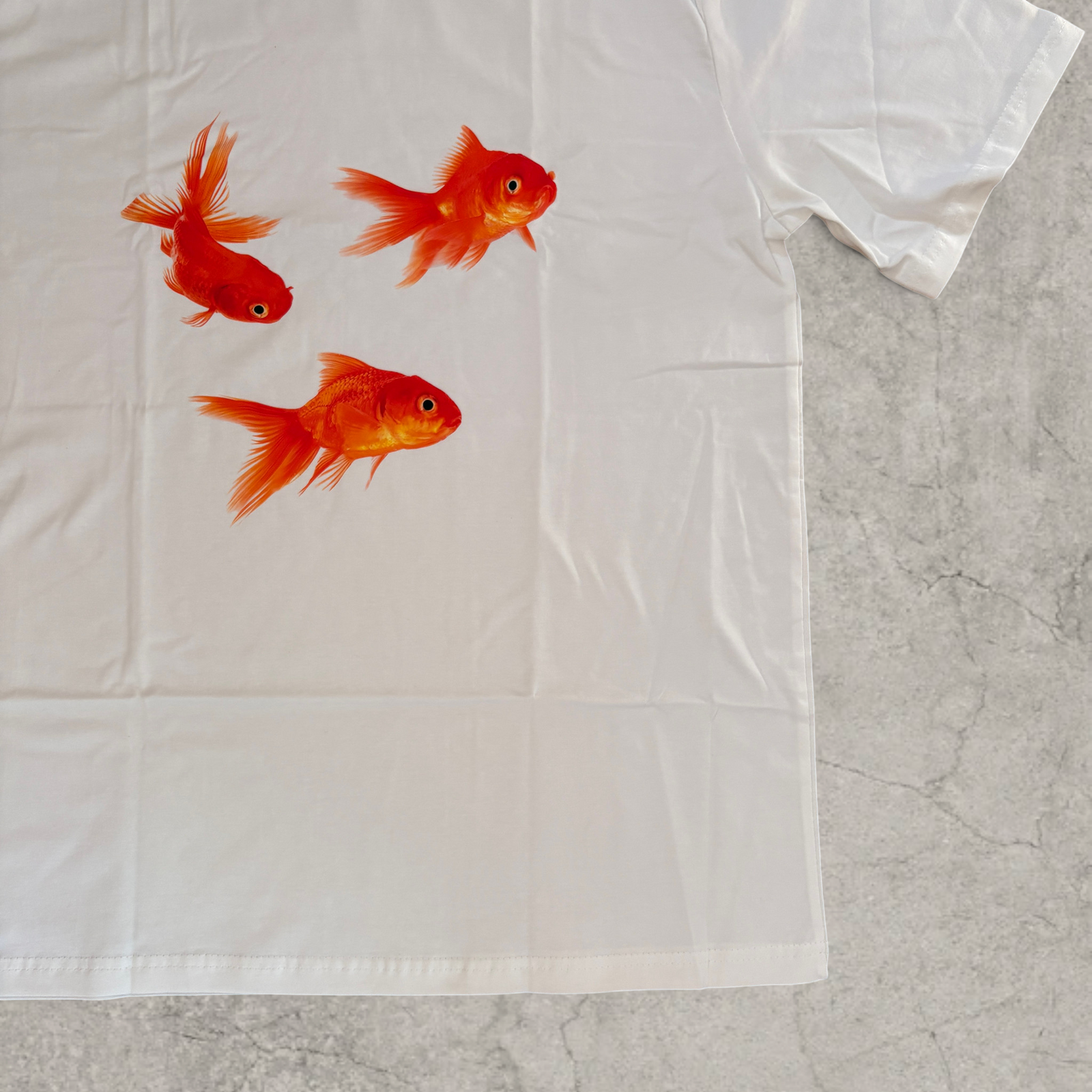 Goldfish vintage style T-shirt with front graphic in white with orange print.
