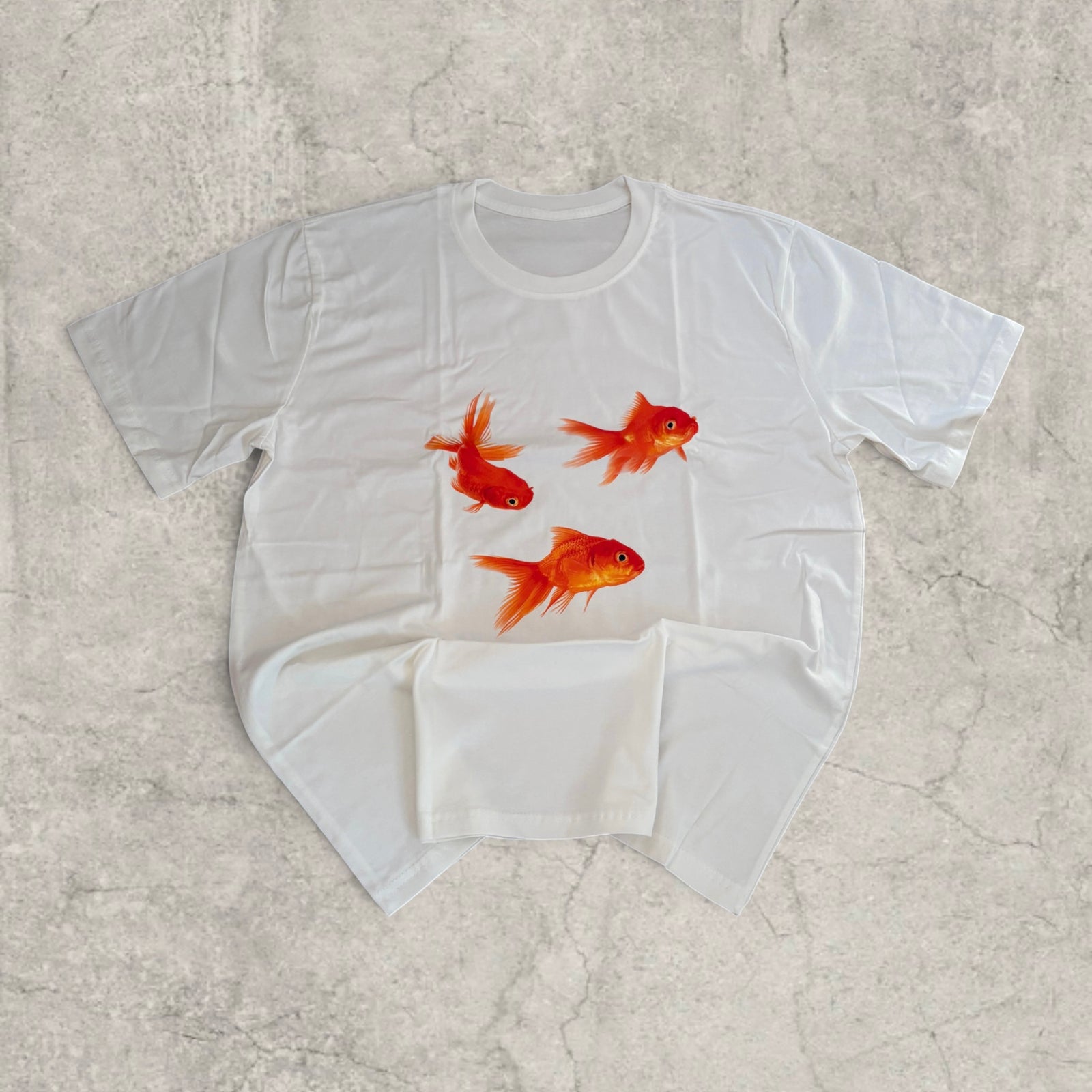 Goldfish vintage style T-shirt with front graphic in white with orange print.
