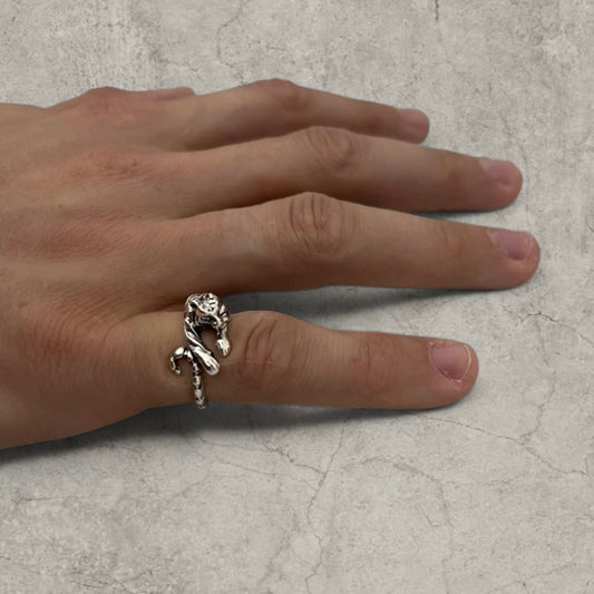 Silver stainless steel ring shaped as a tiger wrapping around a finger on hand
