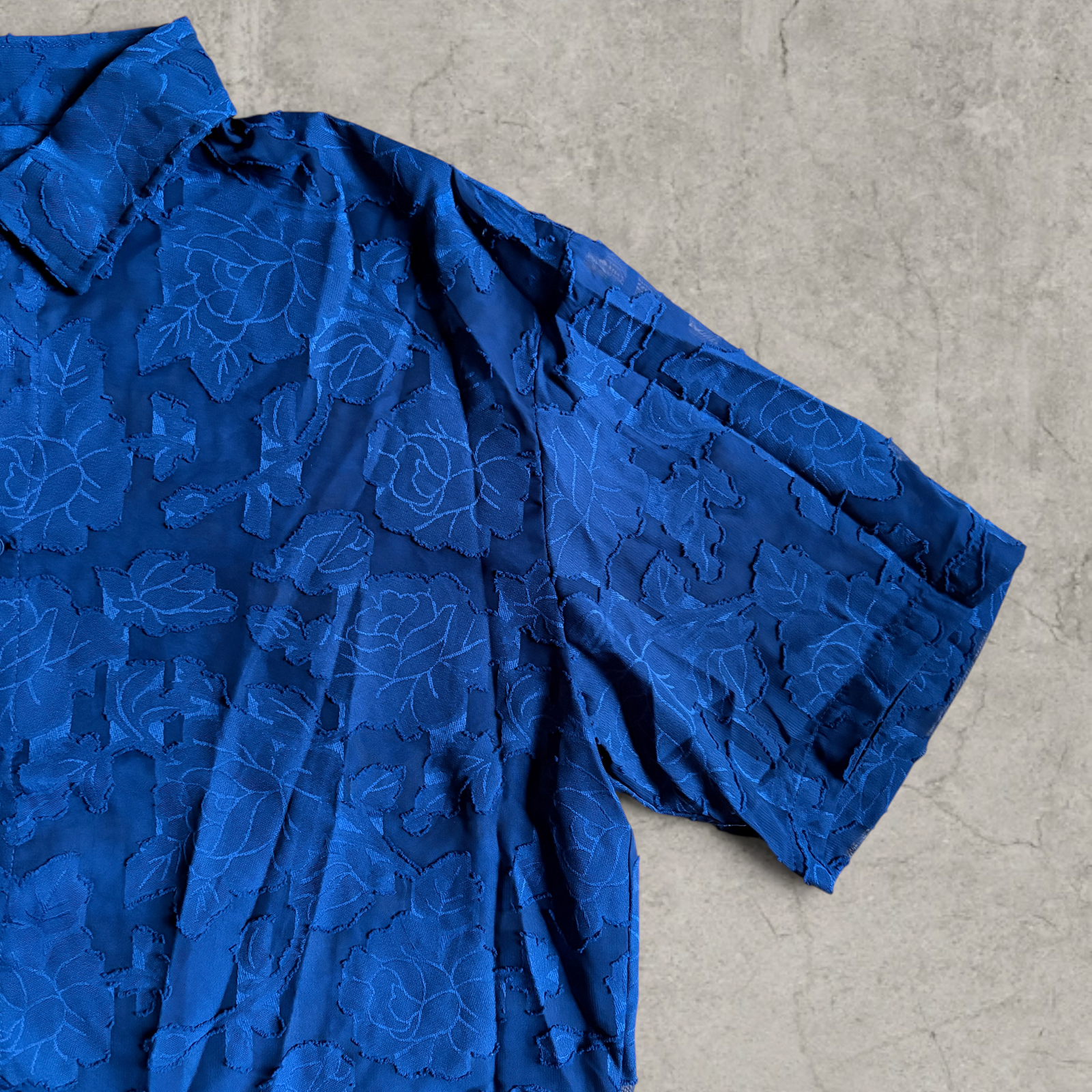 Cool boxy 90s style blue floral short sleeved shirt.