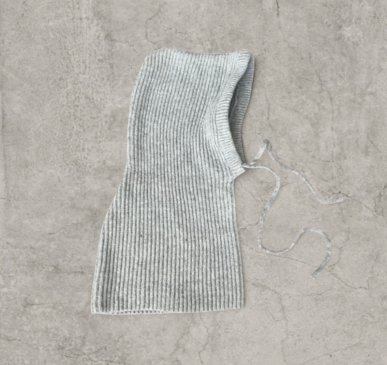 Knitted hooded snood scarf bonnet hat with drawstring in light grey.