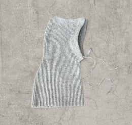 Knitted hooded snood scarf bonnet hat with drawstring in light grey.