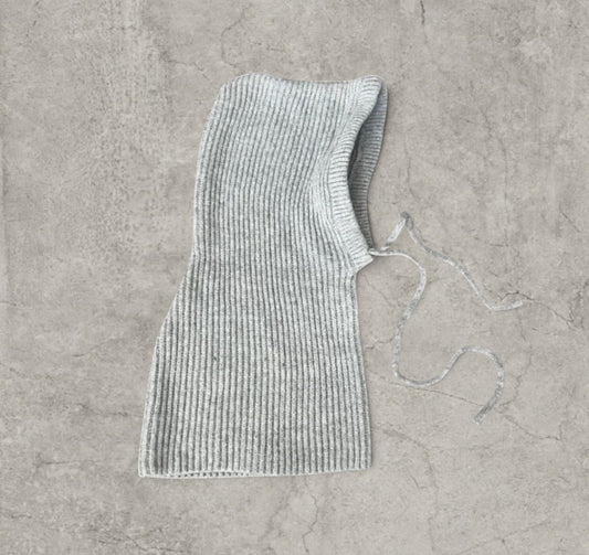 Knitted hooded snood scarf bonnet hat with drawstring in light grey.