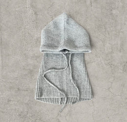 Knitted hooded snood scarf bonnet hat with drawstring in light grey.