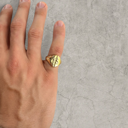 Colour stainless steel signet ring in gold with sword engraved emblem.