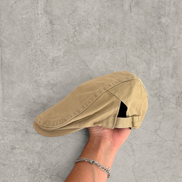 Flat peak beret cap in brown/beige with Boston logo.