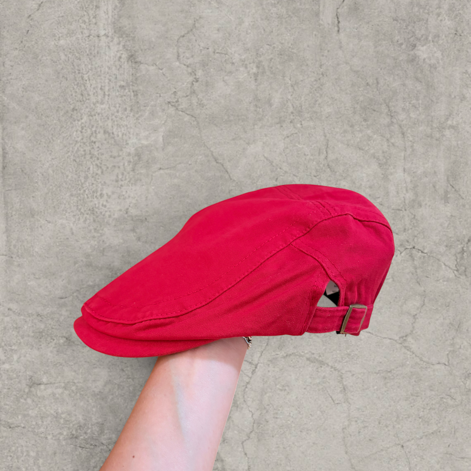 Plaid flat peak beret cap adjustable buckle in red with Boston logo.