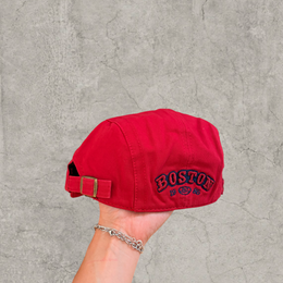 Plaid flat peak beret cap adjustable buckle in red with Boston logo.