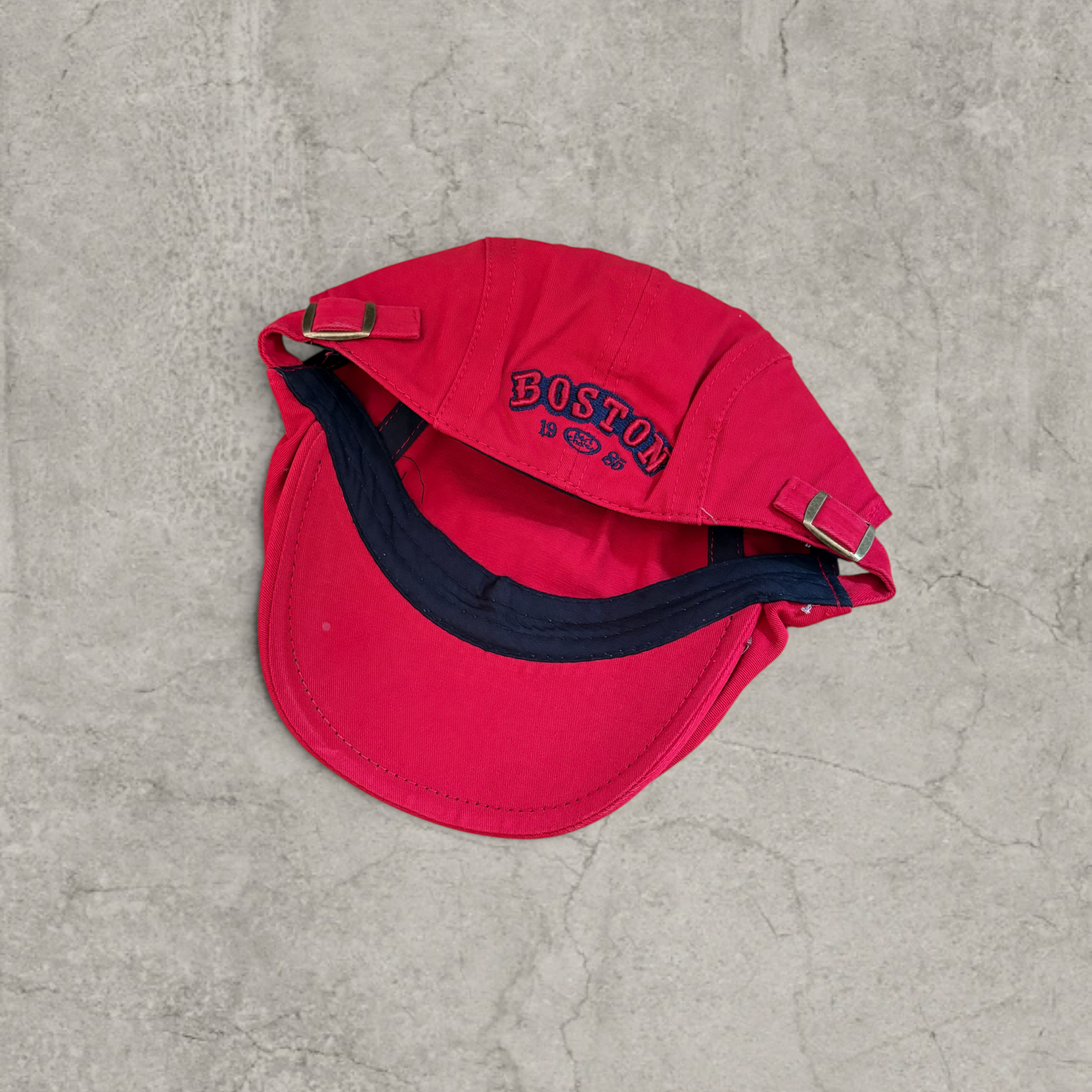 Plaid flat peak beret cap adjustable buckle in red with Boston logo.