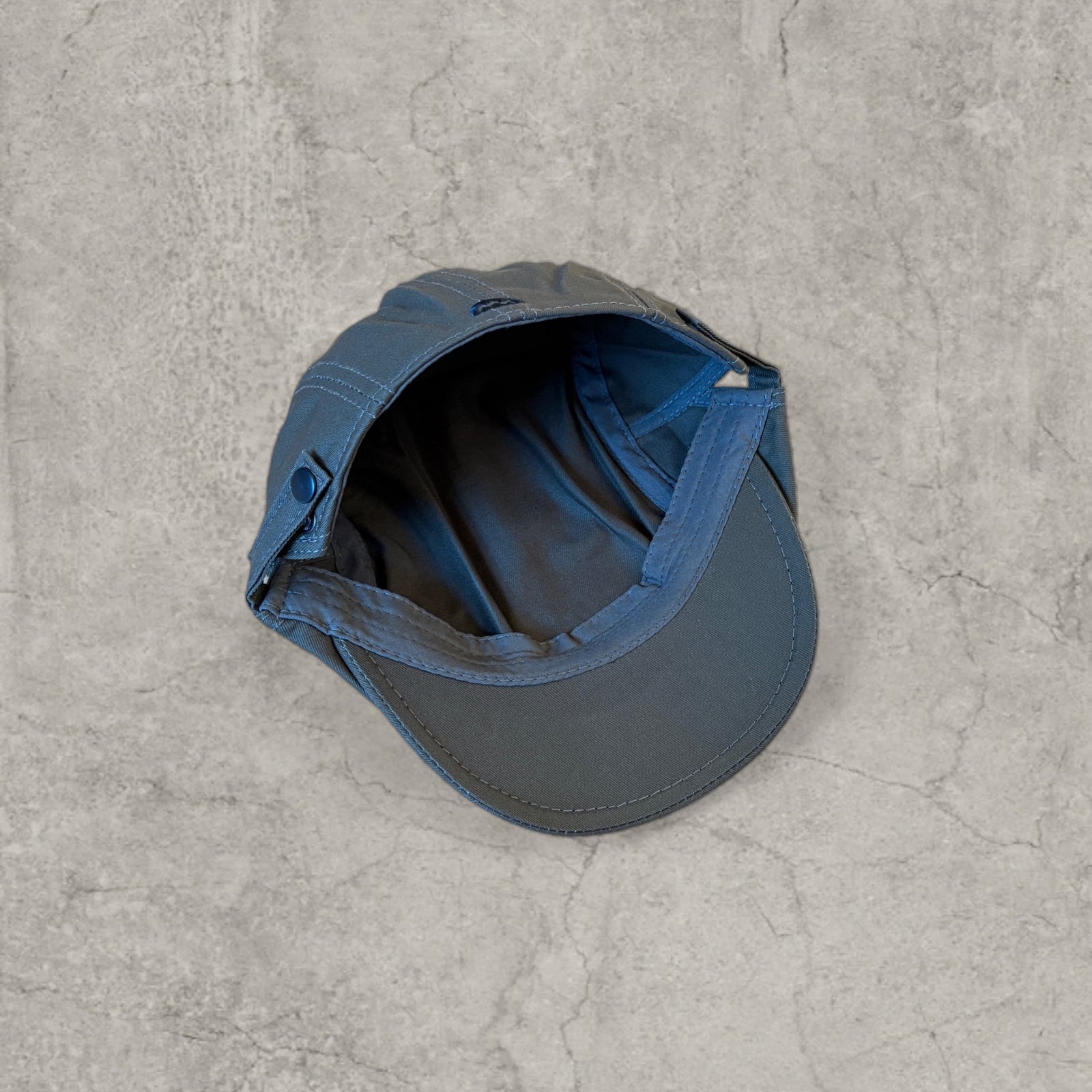 Flat cap in khaki green with black embroidery