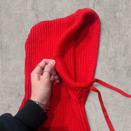 Knitted hooded snood scarf bonnet hat with drawstring in red.