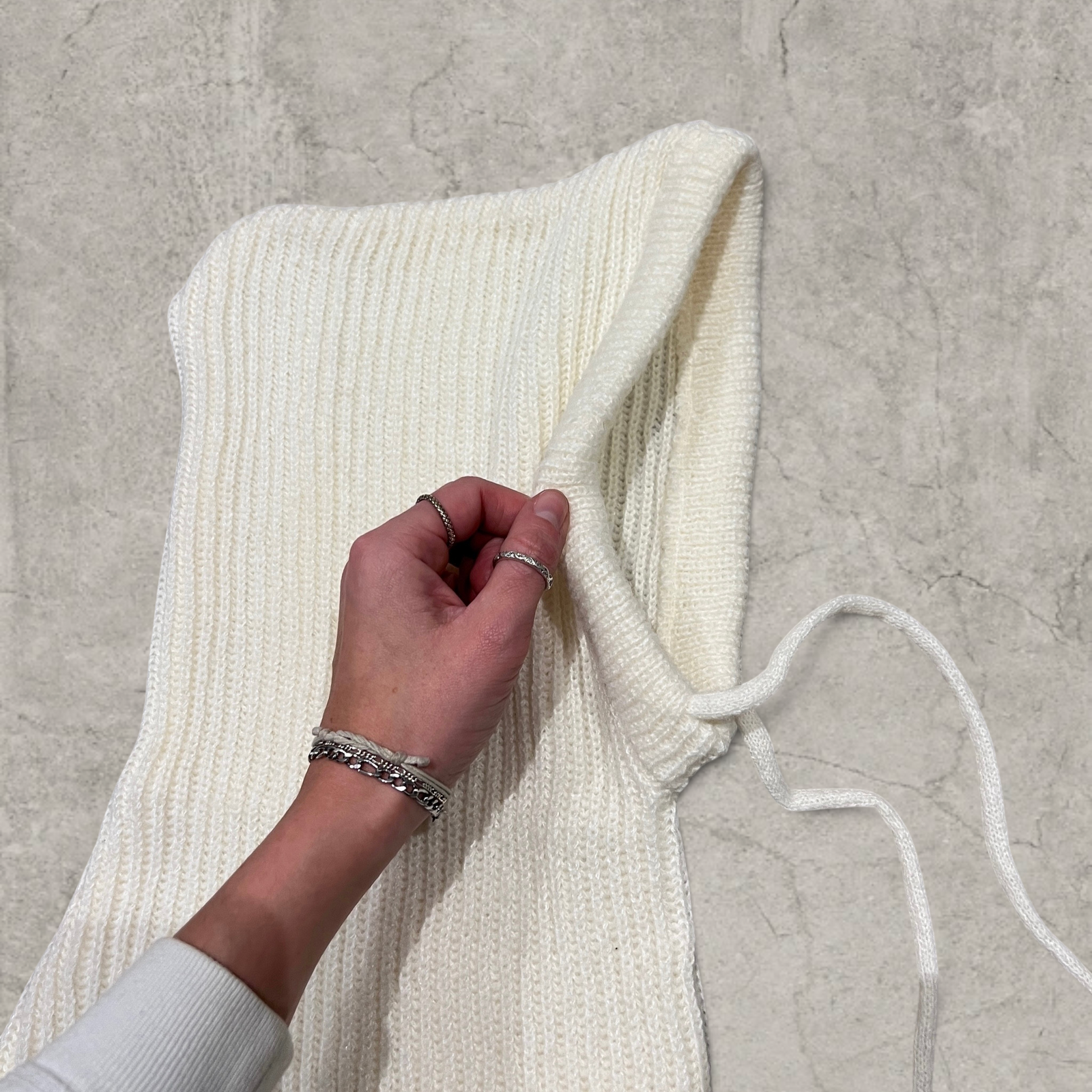 Knitted hooded snood scarf bonnet hat with drawstring in Cream.