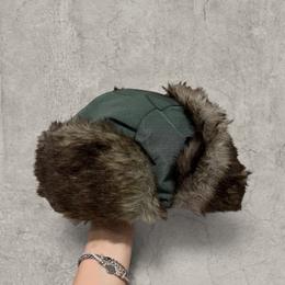 Russian ushanka hat in dark green with grey faux fur.