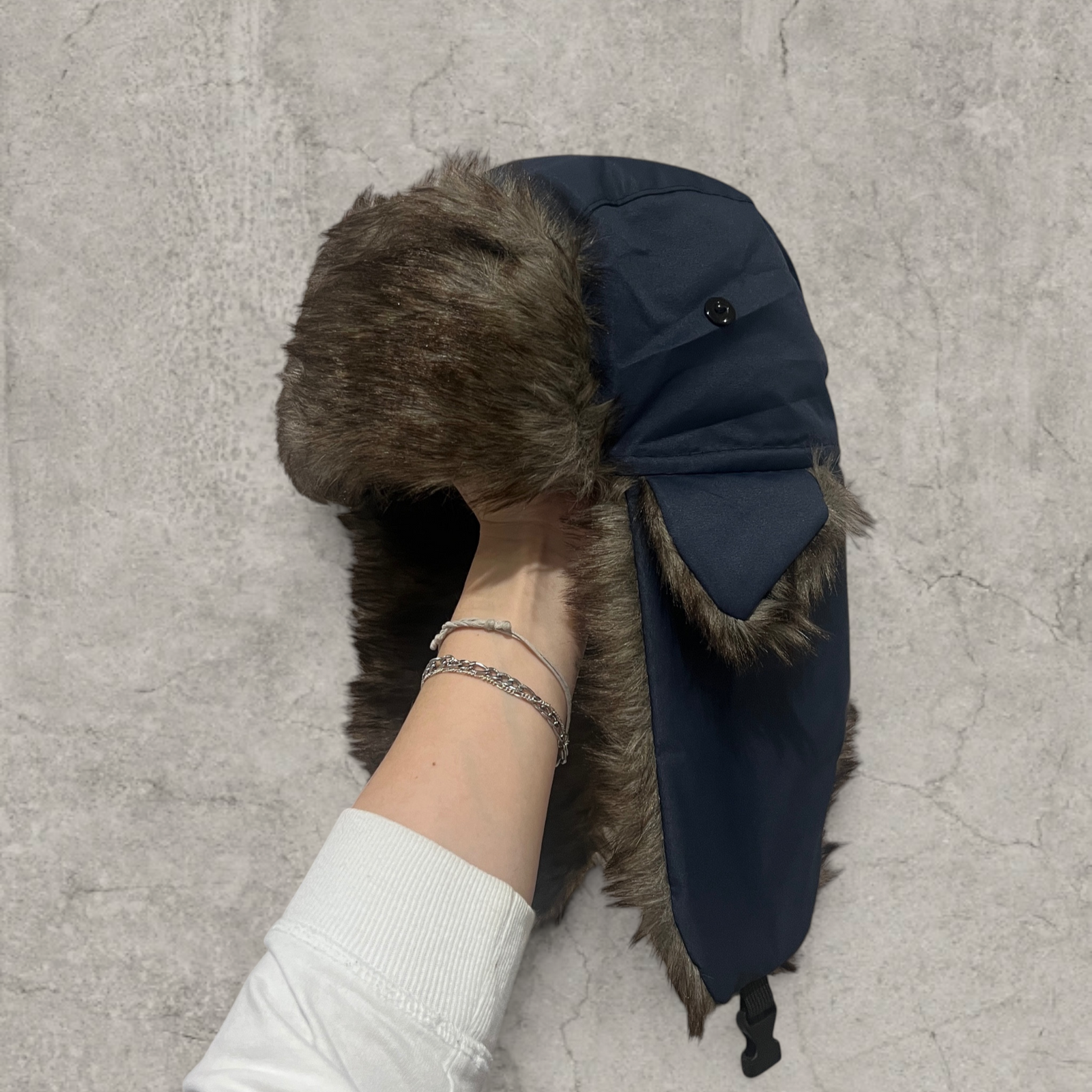 Russian ushanka hat in navy blue with grey faux fur.