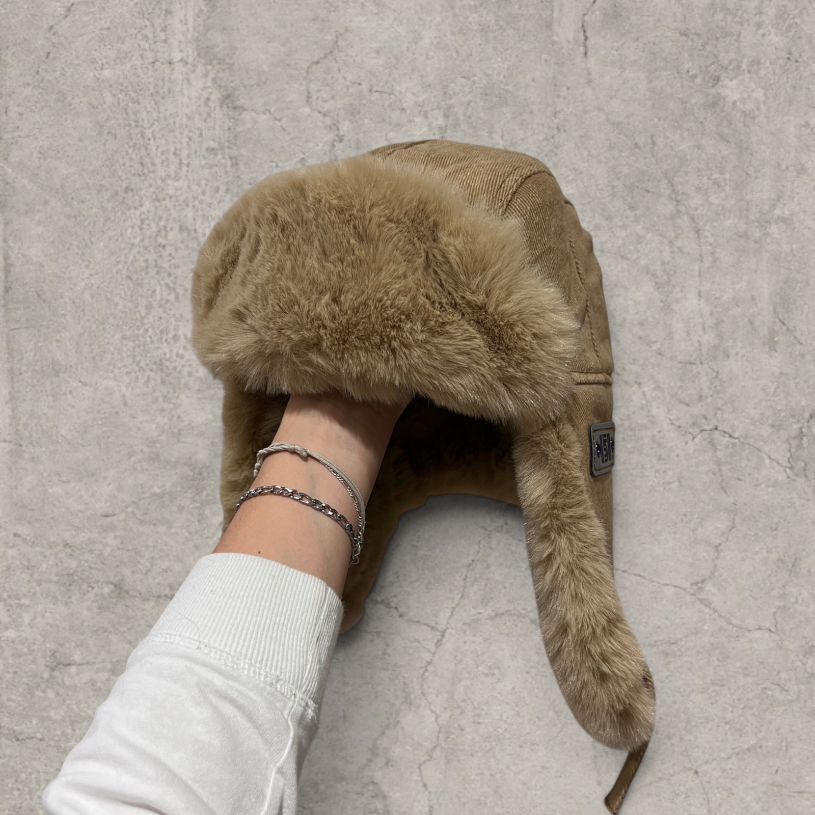 Russian ushanka hat in beige/brown with beige/tan faux fur.