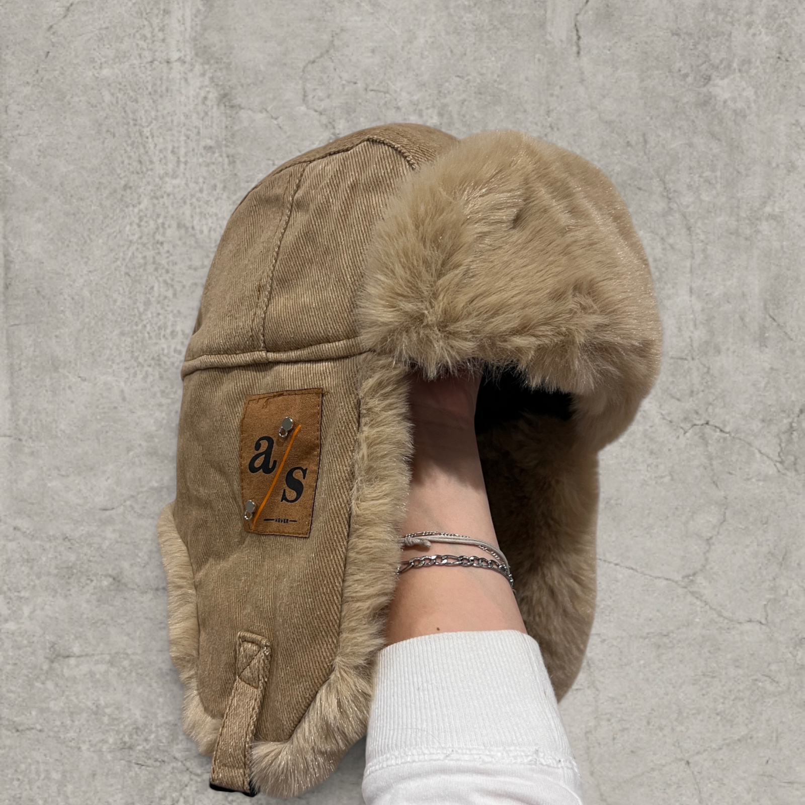 Russian ushanka hat in beige/brown with beige/tan faux fur.