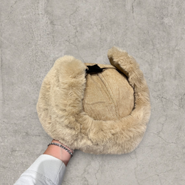 Russian ushanka hat in beige/brown with beige/tan faux fur.