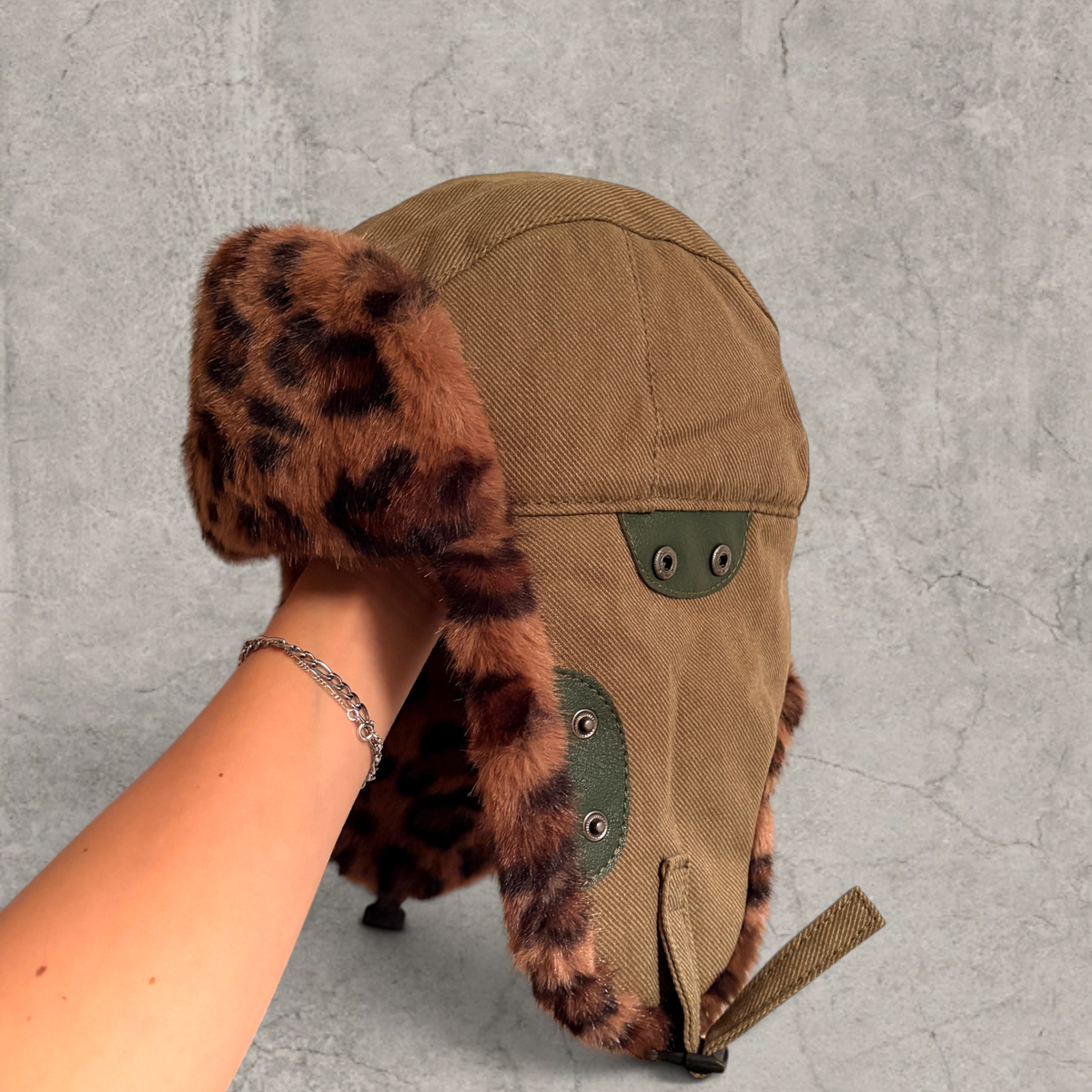 Russian ushanka hat in khaki green with brown leopard faux fur.