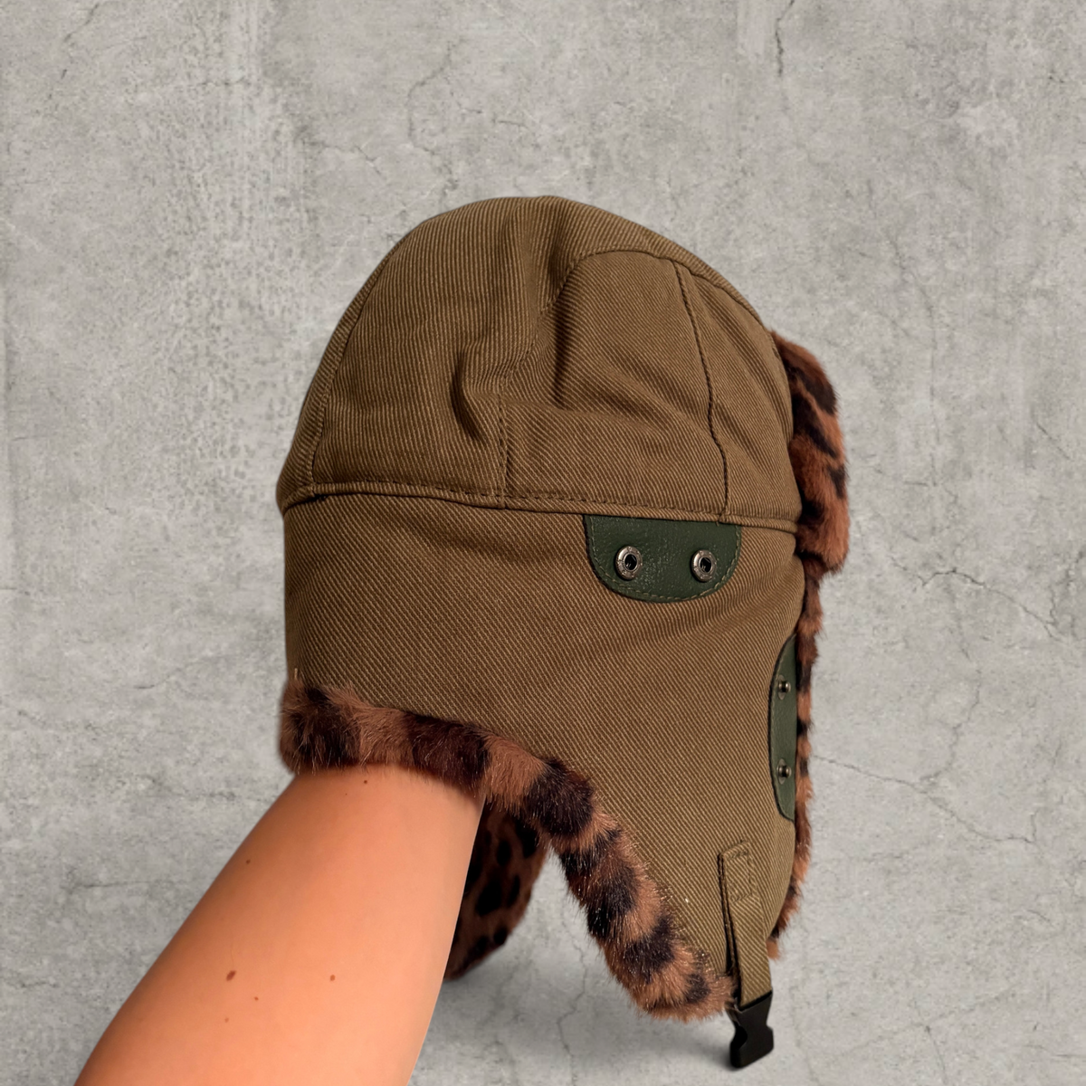 Russian ushanka hat in khaki green with brown leopard faux fur.