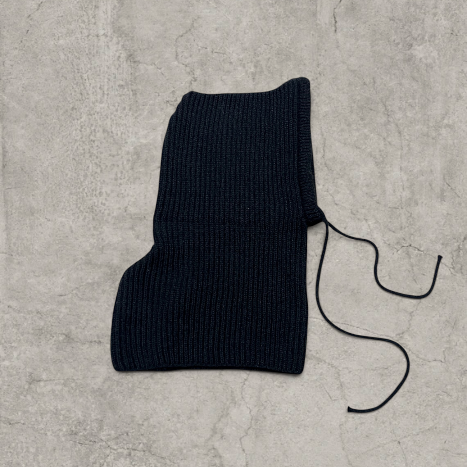 Knitted hooded snood scarf bonnet hat with drawstring in black.
