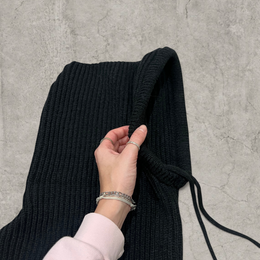 Knitted hooded snood scarf bonnet hat with drawstring in black.