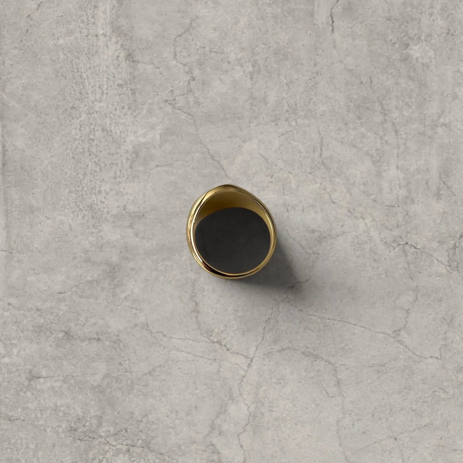 Cool vintage style gold colour stainless steel signet ring with engraved emblem.