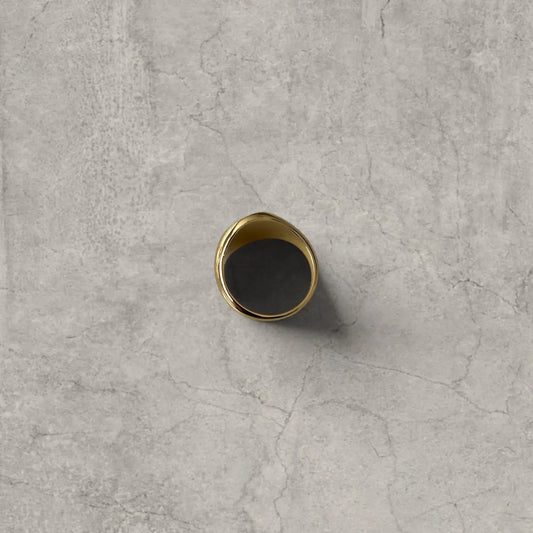 Cool vintage style gold colour stainless steel signet ring with engraved emblem.