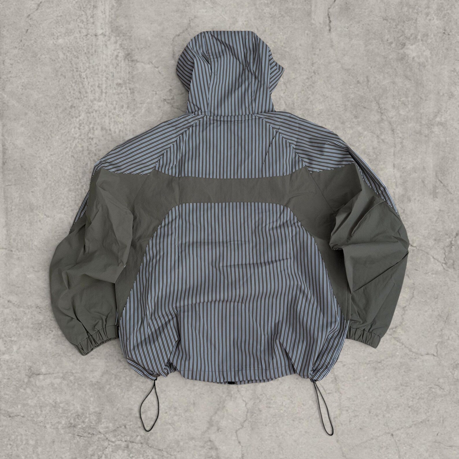 Insane skate khaki green/brown striped gorpcore jacket with hood, zip up and toggle.