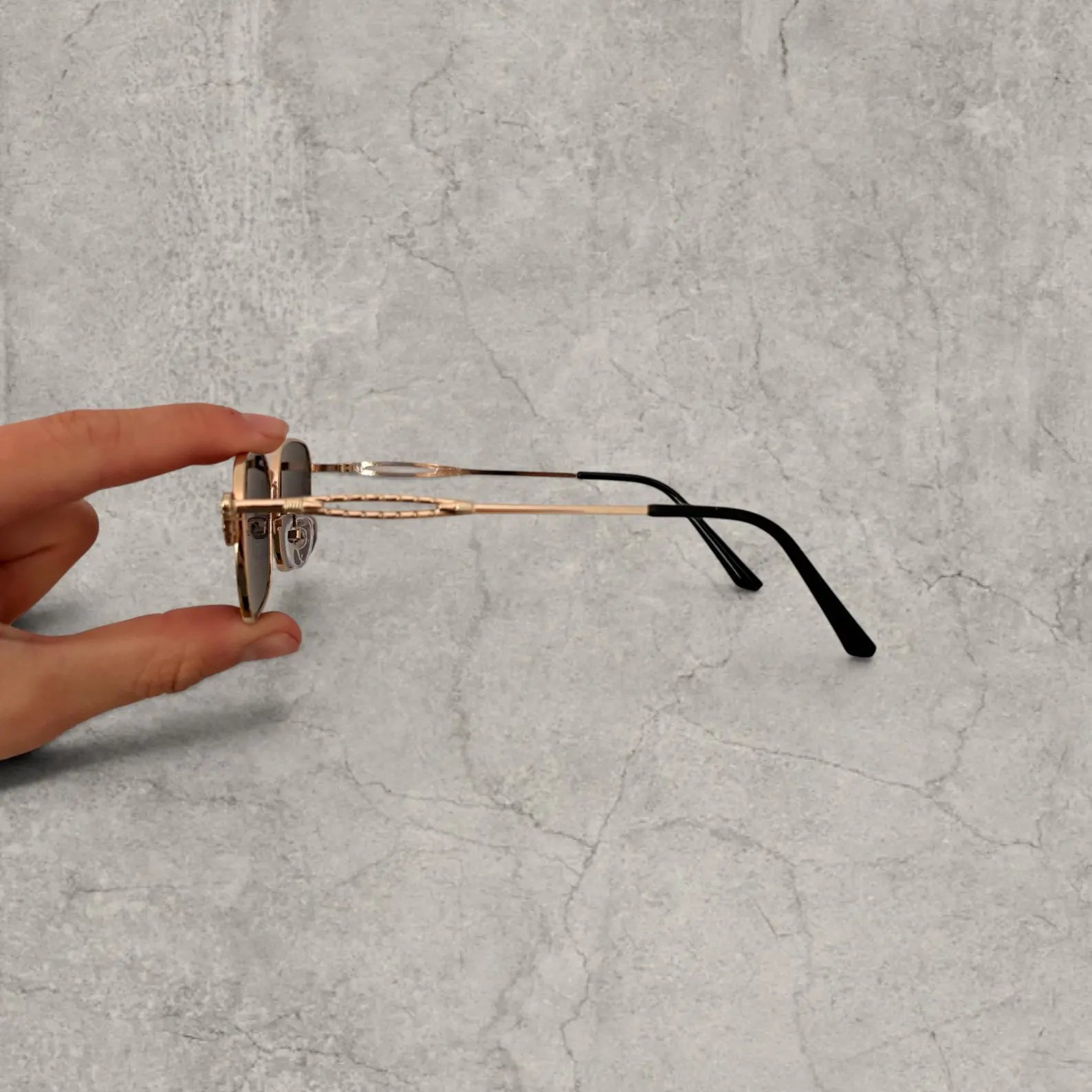 Insane UV400 sunglasses in gold grey with black lense. One size.