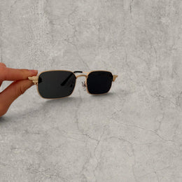 Insane UV400 sunglasses in gold grey with black lense. One size.