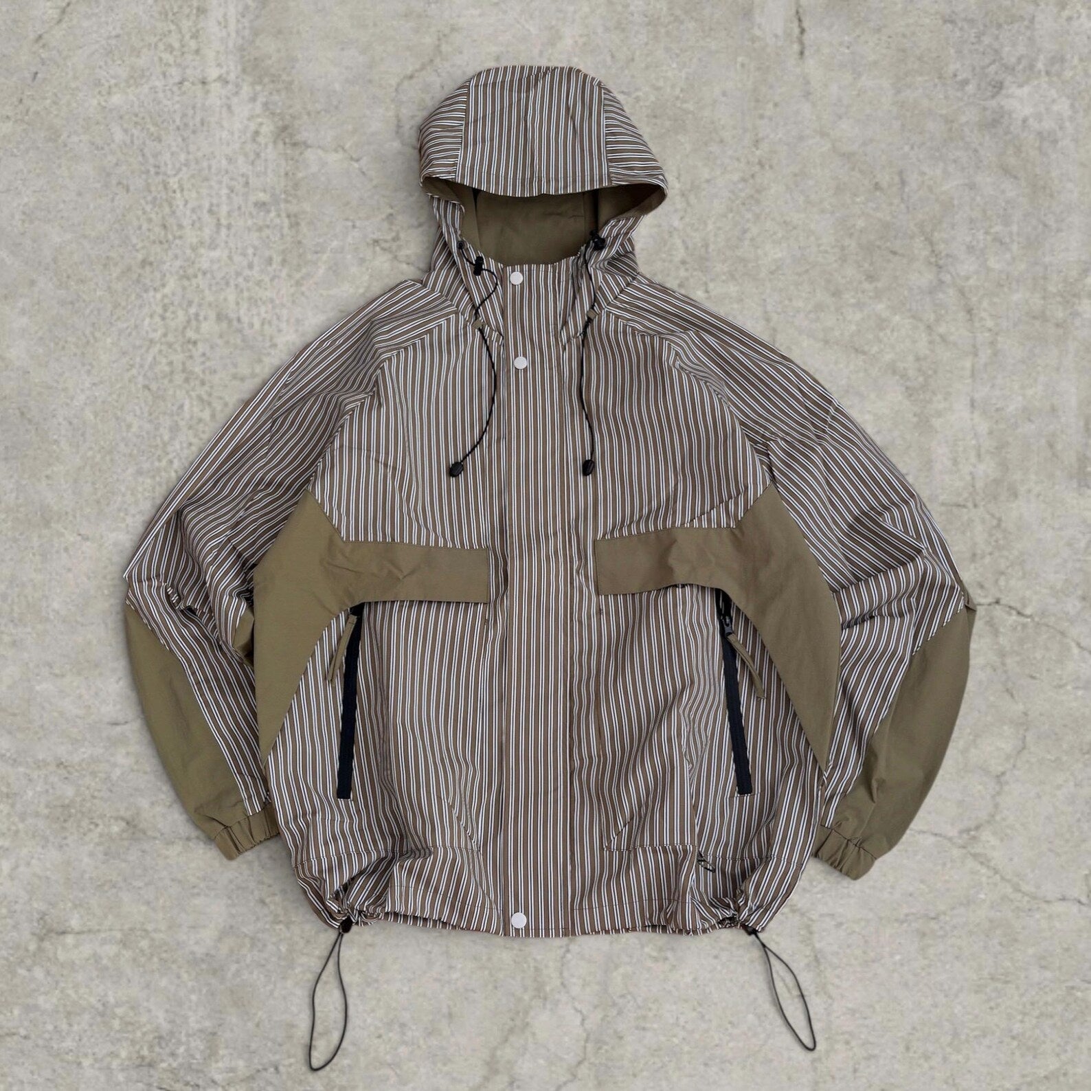 Insane skate khaki green/brown striped gorpcore jacket with hood, zip up and toggle.