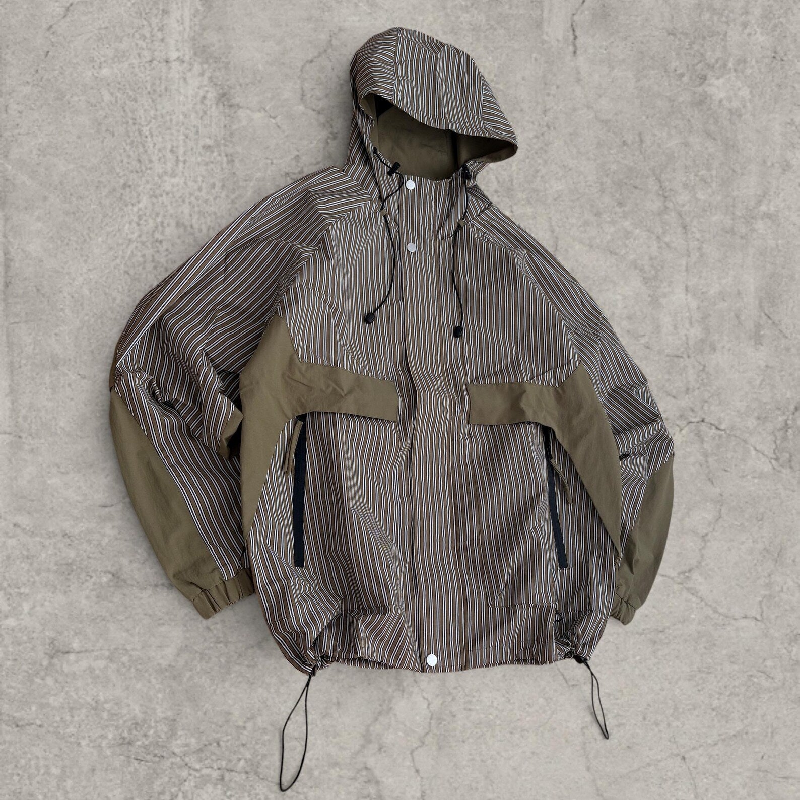 Insane skate khaki green/brown striped gorpcore jacket with hood, zip up and toggle.