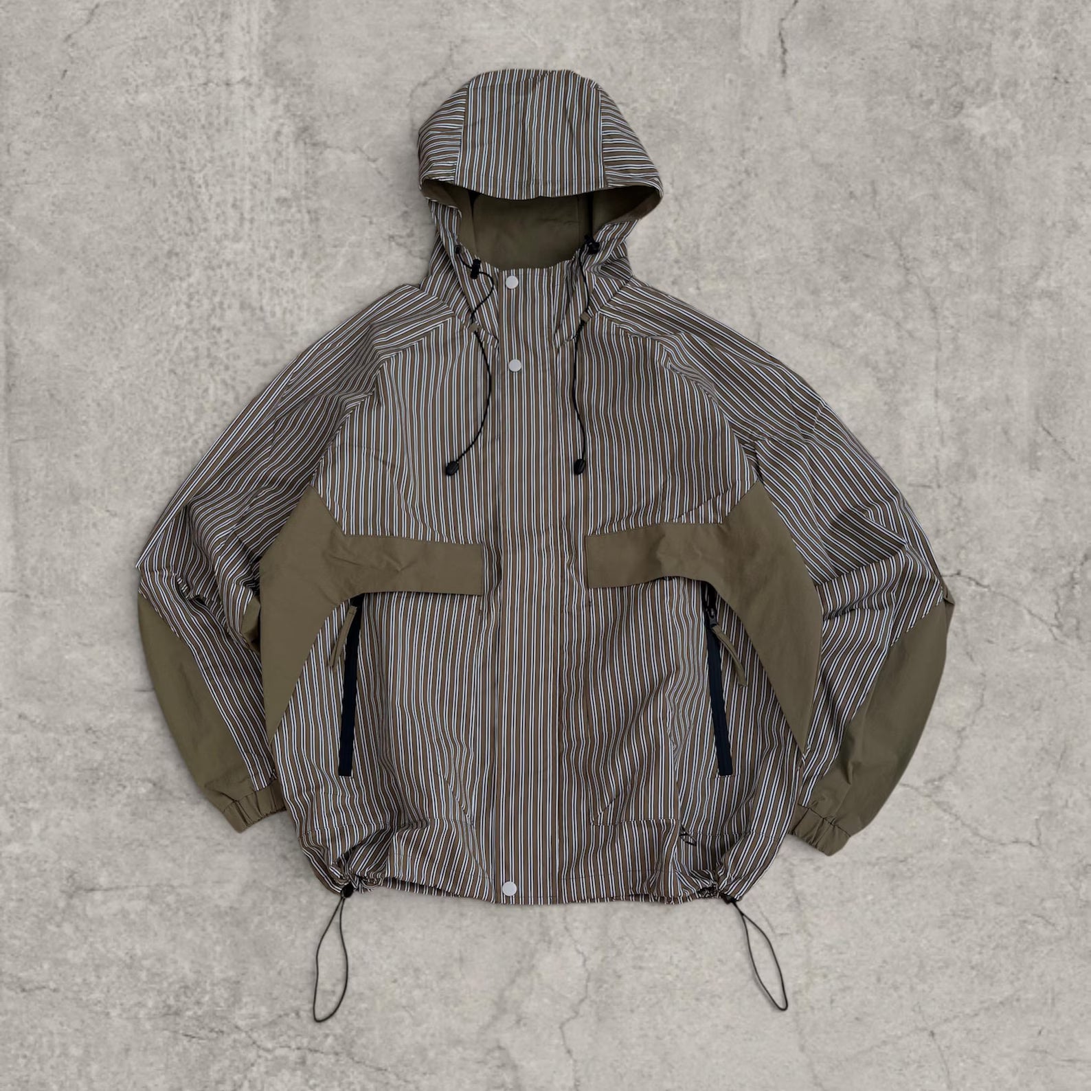 Insane skate khaki green/brown striped gorpcore jacket with hood, zip up and toggle.