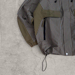 Insane skate khaki green/brown striped gorpcore jacket with hood, zip up and toggle.