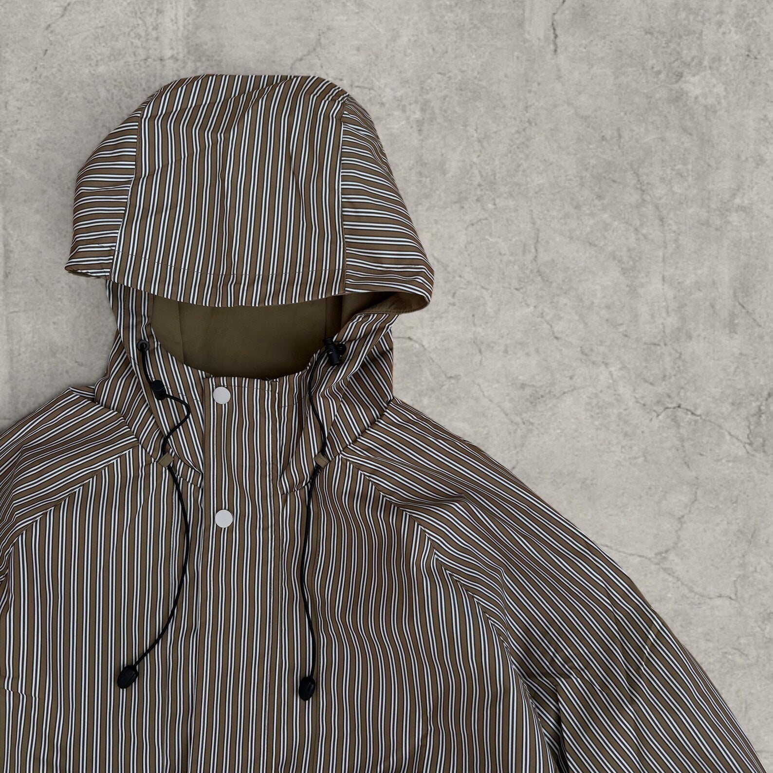 Insane skate khaki green/brown striped gorpcore jacket with hood, zip up and toggle.