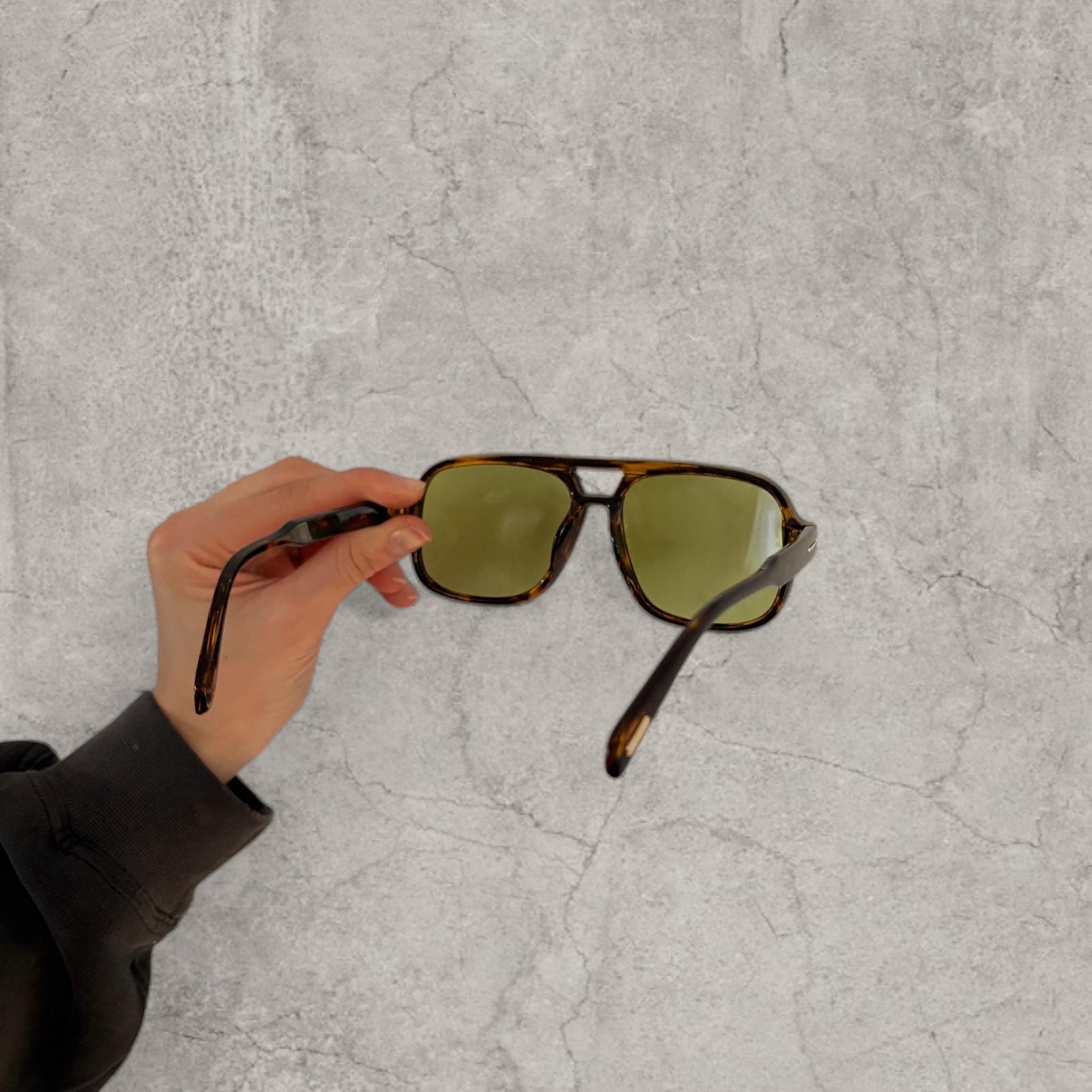 Vintage style aviator sunglasses with green tinted lenses in tortoise shell frame