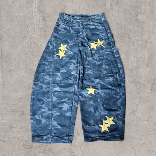 Front view of wide-leg grey khaki camo jeans with yellow star details