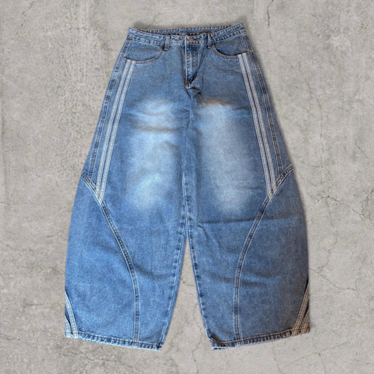 Front view of washed blue wide-leg skater jeans with Japanese-style stripes down sides